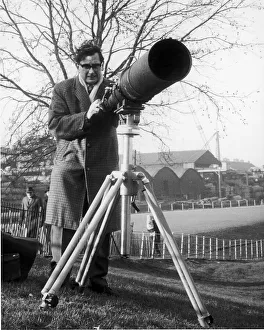 Daily Mirror Photographer Charles Ley seen here with a telephoto lens attached to his Daily Mirror Photographer Charles Ley seen here with a telephoto lens attached to his