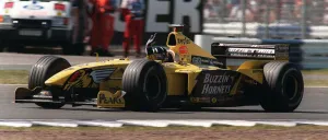 Damon Hill at the British Grand Prix July 1999 waves to the crowd at the end of the race Damon Hill at the British Grand Prix July 1999 waves to the crowd at the end of the race