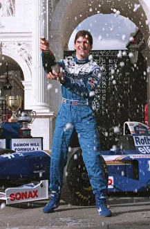 Damon Hill Motor Racing Formula One champion celebrates at Marble Arch with champagne Damon Hill Motor Racing Formula One champion celebrates at Marble Arch with champagne