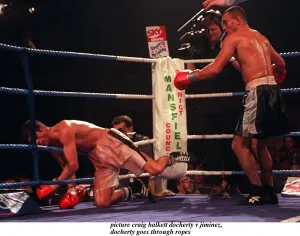 Daniel Jiminez of Puerto Rico punches Drew Docherty of Scotland through the ropes Daniel Jiminez of Puerto Rico punches Drew Docherty of Scotland through the ropes