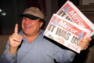 Danny DeVito Actor holding the Daily Mirror Newspaper Danny DeVito Actor holding the Daily Mirror Newspaper