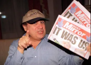 Danny DeVito Actor holding the Daily Mirror Newspaper Danny DeVito Actor holding the Daily Mirror Newspaper