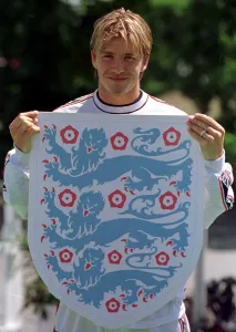 David Beckham holds up the three lions badge June 1998 during a England training David Beckham holds up the three lions badge June 1998 during a England training