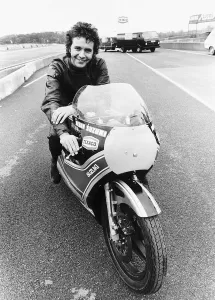 David Essex on the set of his film Silver Dream Racer sitting on a £40 David Essex on the set of his film Silver Dream Racer sitting on a £40