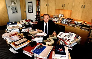 David Frost TV Presenter a glance at his cluttered desk research material David Frost TV Presenter a glance at his cluttered desk research material