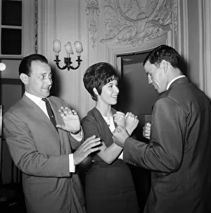 David Jacobs cowers behind singer Helen Shapiro as she 'shapes up" David Jacobs cowers behind singer Helen Shapiro as she 'shapes up"