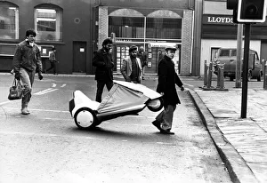 David out and about on his Sinclair C5 in Cardiff. Crossing the road is no problem David out and about on his Sinclair C5 in Cardiff. Crossing the road is no problem