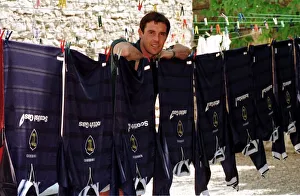 David Weir posing beside a washing line holding Scotland tops during the World Cup David Weir posing beside a washing line holding Scotland tops during the World Cup