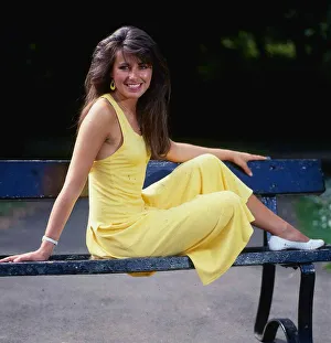 Debbie Greenwood TV presenter July 1987 sitting o a bench wearing a yellow dress Debbie Greenwood TV presenter July 1987 sitting o a bench wearing a yellow dress