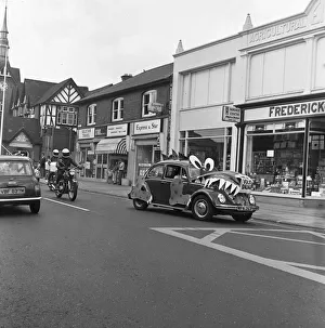 A decorated VW Beetle drives along Bridge Road, Stafford to promote the new " A decorated VW Beetle drives along Bridge Road, Stafford to promote the new "