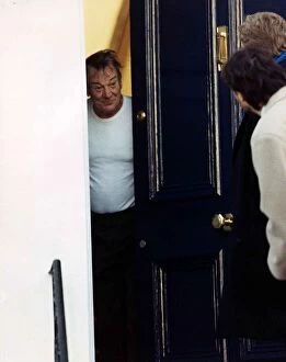 Images Dated 25th January 1989: Denholm Elliott British Actor - January 1989 At His Front Door Talking To