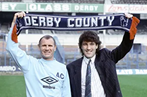 Derby County manager Arthur Cox with new signing Dean Saunders holding a club scarf aloft Derby County manager Arthur Cox with new signing Dean Saunders holding a club scarf aloft