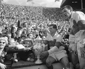 Derek Turner of Wakefield Trinity shows the trophy to fans after their 25 - 10 victory Derek Turner of Wakefield Trinity shows the trophy to fans after their 25 - 10 victory