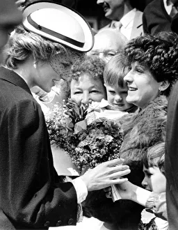 Diana, Princes of Wales receives a bouquet from an adoring well-wisher in the crowd Diana, Princes of Wales receives a bouquet from an adoring well-wisher in the crowd