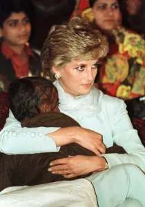 Diana, Princess of Wales cuddles a blind child during a visit to the Shaukat Khanum Diana, Princess of Wales cuddles a blind child during a visit to the Shaukat Khanum