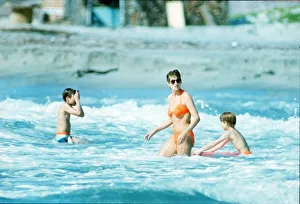 Diana, Princess of Wales in the water with her children Prince William Diana, Princess of Wales in the water with her children Prince William