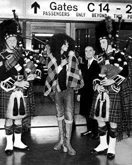 Diana Ross on arrival in Scotland is greeted by two pipers. 1st October 1973 Diana Ross on arrival in Scotland is greeted by two pipers. 1st October 1973