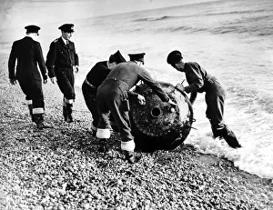 Mine disposal team deal with a mine in Rye Bay England during WW2 1945 Mine disposal team deal with a mine in Rye Bay England during WW2 1945