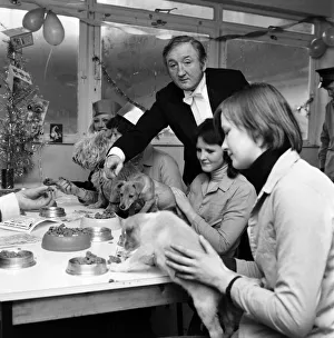 Dog Owners and their pets seen here having a Christmas party as actor Ronald Fraser acts Dog Owners and their pets seen here having a Christmas party as actor Ronald Fraser acts