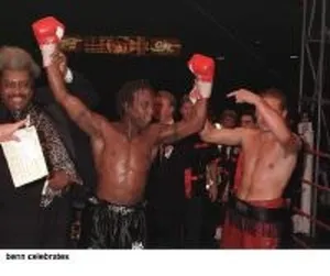 Don King and Danny Perez hold up Nigel Benns arms in victory after the fight at Wembley Don King and Danny Perez hold up Nigel Benns arms in victory after the fight at Wembley