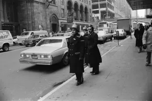 Doormen hailing a cab in New York, 13th February 1981 Doormen hailing a cab in New York, 13th February 1981