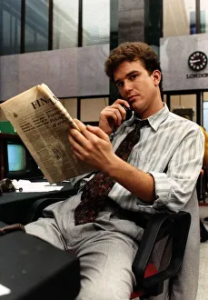 Douglas Hodge actor from TV programme Capitol City, sitting on desk chair talking Douglas Hodge actor from TV programme Capitol City, sitting on desk chair talking