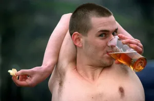 Douglas Kidd drinking glass pint of lager with his arm bent around the back of his head Douglas Kidd drinking glass pint of lager with his arm bent around the back of his head