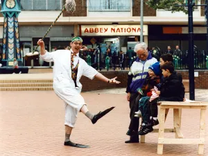 Dr Percy Percil keeps the locals amused at Kirkby shopping centre as they helped Dr Percy Percil keeps the locals amused at Kirkby shopping centre as they helped