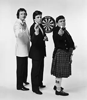 Well dressed British darts players pose for a photoshoot Well dressed British darts players pose for a photoshoot