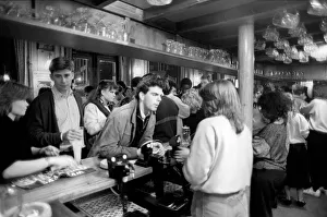 Drinkers in an East End Pub enjoying a pint of beer. March 1987 Drinkers in an East End Pub enjoying a pint of beer. March 1987