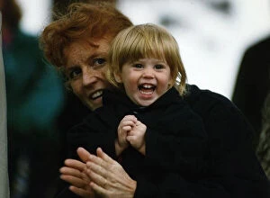 Images Dated 13th May 1990: Duchess of York holds Beatrice tightly after having her pigtails pulled