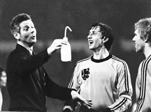 Dutch footballer Johan Cruyff shares a joke with the referee during the England v Holland Dutch footballer Johan Cruyff shares a joke with the referee during the England v Holland