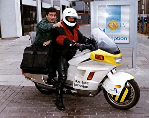 Eamonn Holmes TV Presenter on a Taxi Bike from Addison Lee Eamonn Holmes TV Presenter on a Taxi Bike from Addison Lee