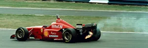 Eddie Irvine retires from the British Grand Prix after the engine of his Ferrari blew up Eddie Irvine retires from the British Grand Prix after the engine of his Ferrari blew up