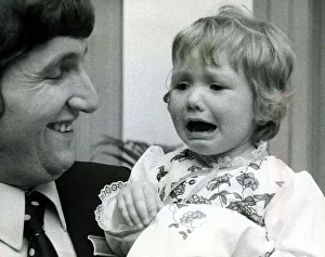 Eighteen month old Clare Timewall held by her father Chris crying her eyes out after Eighteen month old Clare Timewall held by her father Chris crying her eyes out after