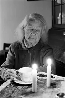 Images Dated 11th February 1972: Elderly woman, drinking a cup of tea, by candlelight, Perry Barr, Birmingham