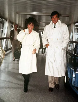 Elizabeth Taylor actress August 1986 at Heathrow Airport with George Hamilton Elizabeth Taylor actress August 1986 at Heathrow Airport with George Hamilton