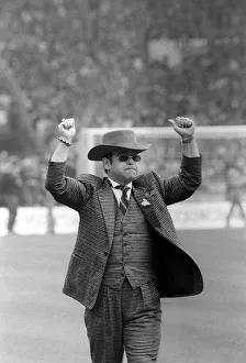 Elton John chairman of Watford on Wembley pitch 1984 before kick off of FA cup Elton John chairman of Watford on Wembley pitch 1984 before kick off of FA cup