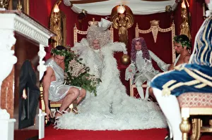 Elton John and David Furnish sitting on thrones in the back of a van which will take them Elton John and David Furnish sitting on thrones in the back of a van which will take them