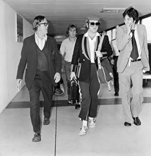 Elton John, departs London Heathrow, heading for Los Angeles. 26th June 1977 Elton John, departs London Heathrow, heading for Los Angeles. 26th June 1977
