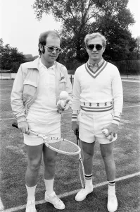 Elton John with Larry King (husband of Billie-Jean King) at Wimbledon playing tennis Elton John with Larry King (husband of Billie-Jean King) at Wimbledon playing tennis