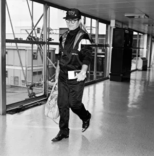 Elton John pictured at London Airport. 19th June 1987 Elton John pictured at London Airport. 19th June 1987