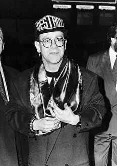 Images Dated 12th November 1990: Elton John pop Star leaving Heathrow airport for Toronto to visit friends in Canada