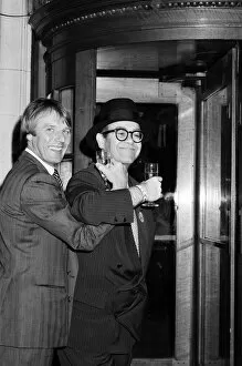 Images Dated 18th May 1987: Elton John presents Watford FCs new manager, Dave Bassett, at a London reception
