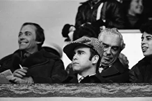 Elton John watching the West Ham United v Watford football match. 7th January 1978 Elton John watching the West Ham United v Watford football match. 7th January 1978