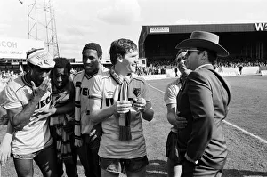 Elton John and some of the Watford side after their match against Liverpool Elton John and some of the Watford side after their match against Liverpool
