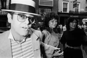 Elton John and his wife Renate arrive at the Comedy Theatre. 14th June 1984 Elton John and his wife Renate arrive at the Comedy Theatre. 14th June 1984
