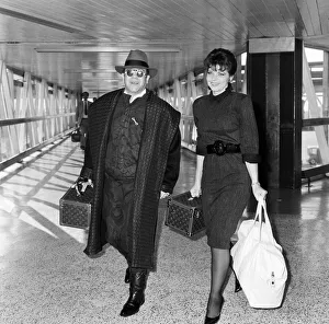 Elton John with his wife Renate arriving from Los Angeles at London Airport Elton John with his wife Renate arriving from Los Angeles at London Airport