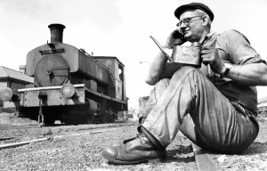 An engineer taking a break from working on this old steam locomotive on 21st August 1972 An engineer taking a break from working on this old steam locomotive on 21st August 1972