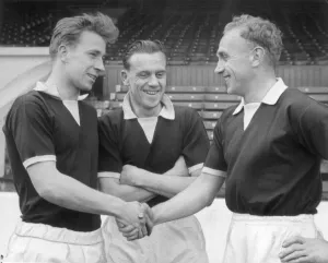 England captain Billy Wright (right) shakes hands with new recruit Bobby Charlton of England captain Billy Wright (right) shakes hands with new recruit Bobby Charlton of